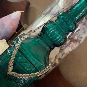 1/2 “ thick, 8” long, gold necklace.